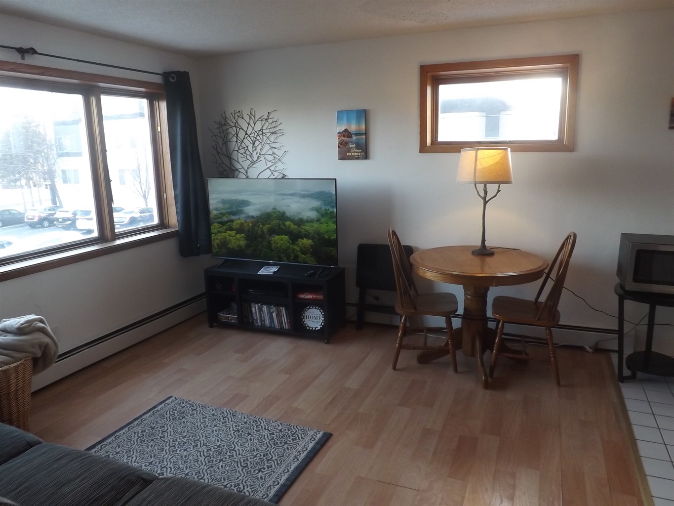 Reclining sofa with large Roku smart TV in living room