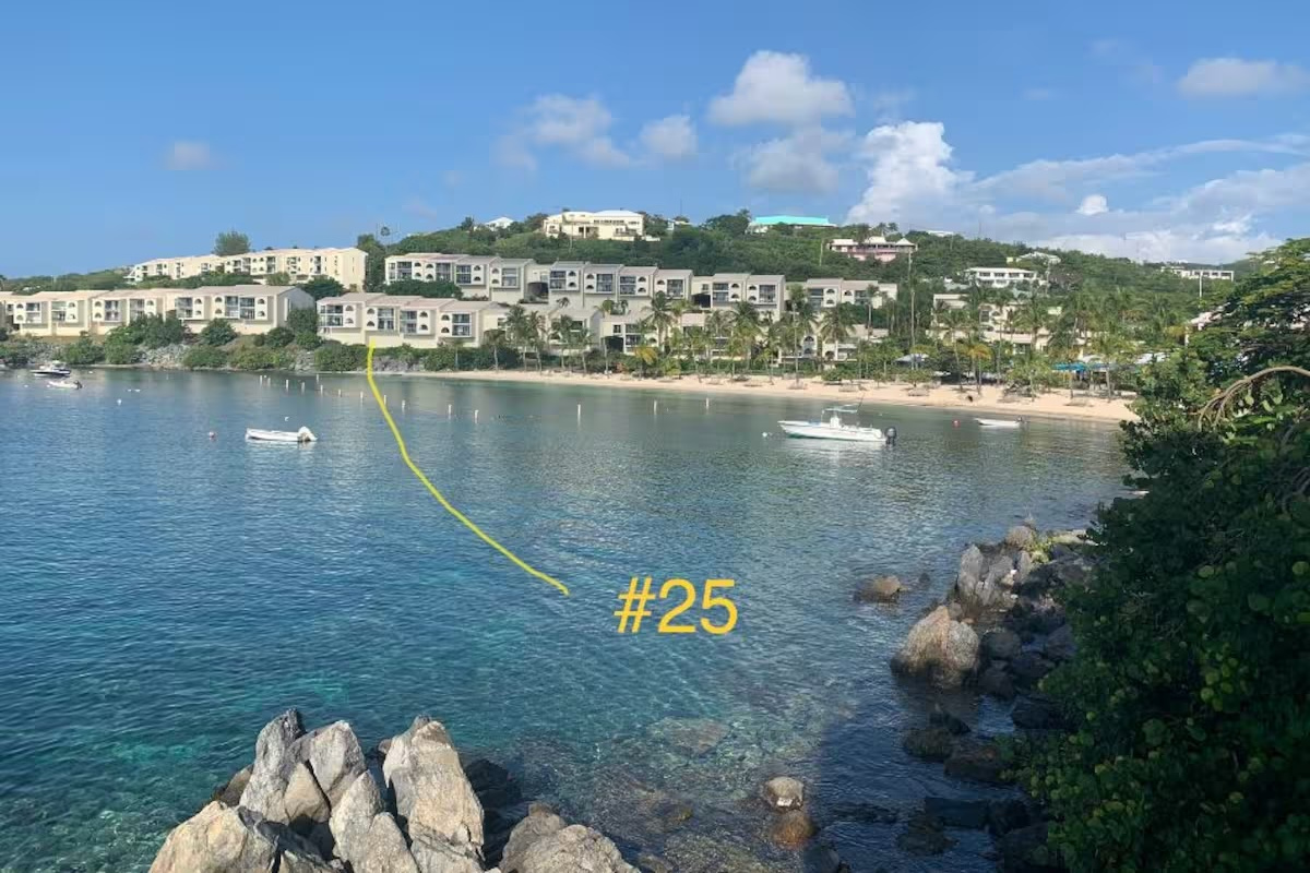 Prime waterfront location with direct access to Cowpet Bay.