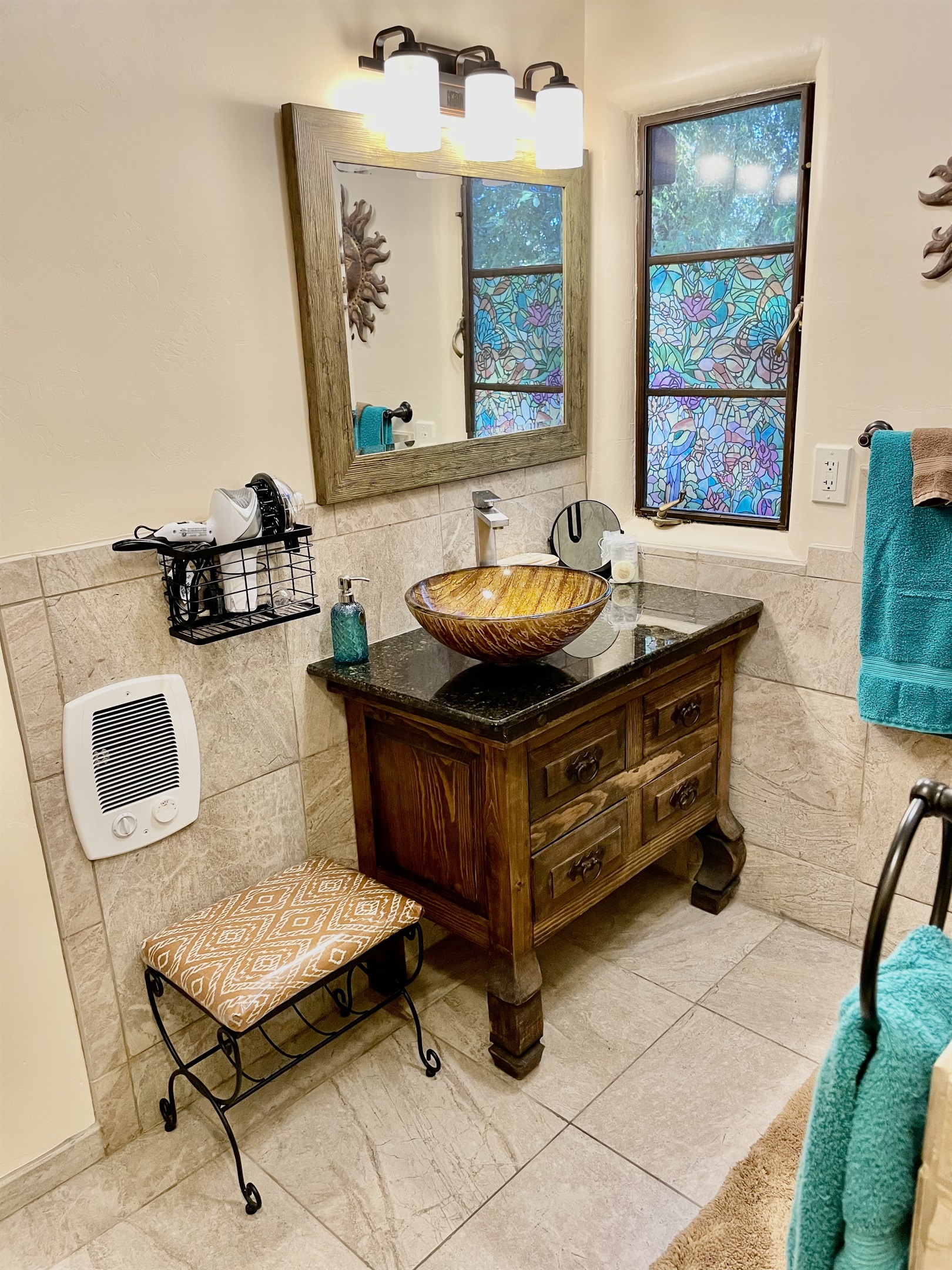 Spa-like bathroom with walk-in shower and cozy heater.
