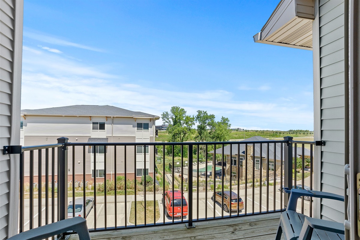Step out onto your private balcony and enjoy peaceful views of the community and green space beyond — the perfect spot for your morning coffee or an evening wind-down.