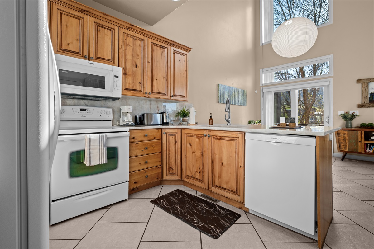 Fully equipped kitchen with generous counter space and everything needed for family meals or après-ski snacks.