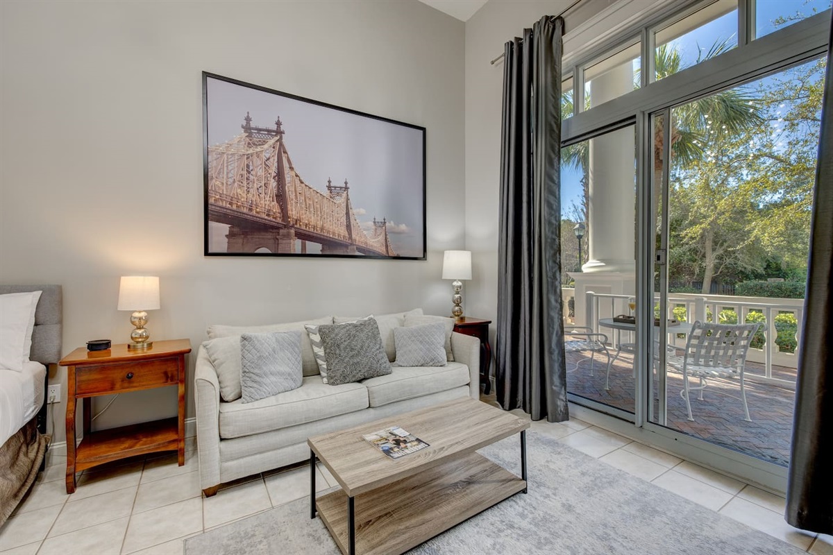 The living room area is furnished with a queen-size pullout and walks right out onto the patio.