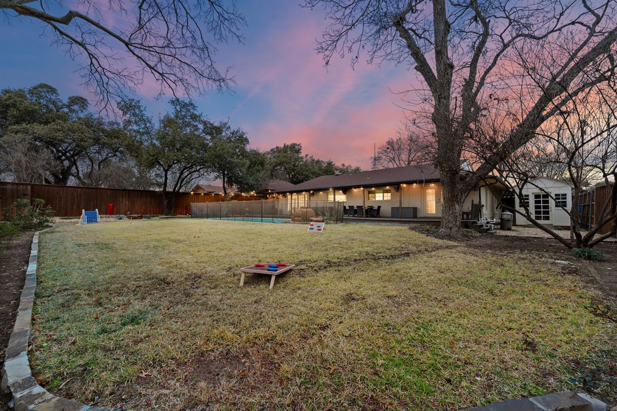 Play cornhole in the massive fenced backyard—ideal for families or friend groups.