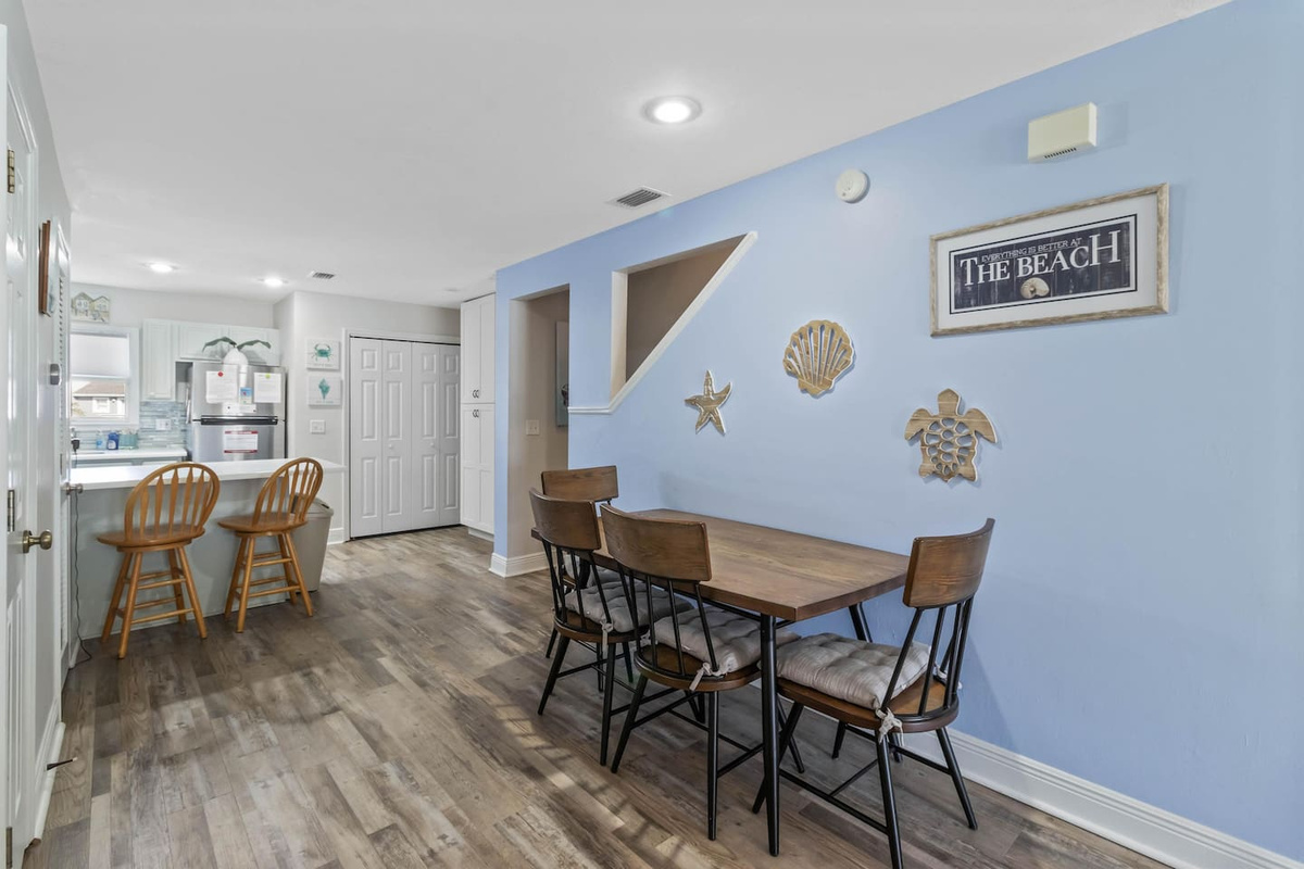  Grab a stool at the breakfast bar or pull up a chair at the table &mdash; the open dining area keeps everyone in the conversation.