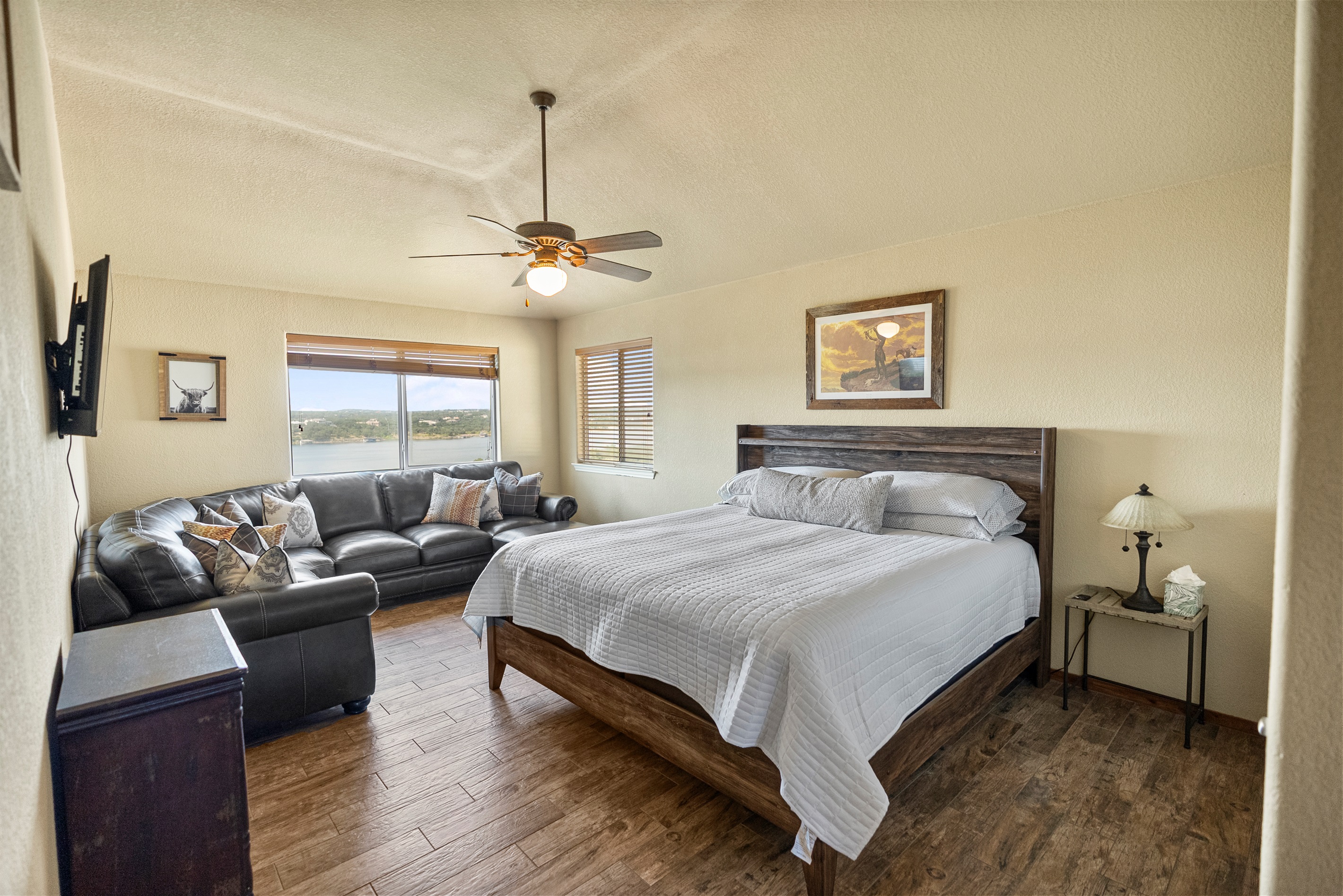 King bed with smart TV, couch, and private en-suite bathroom.