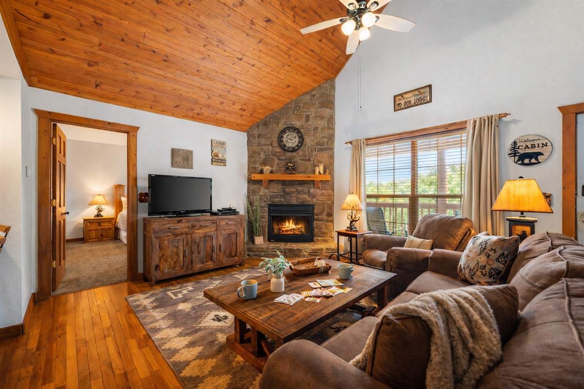 Welcoming living room featuring sleeper sofa and Warm Fireplace 