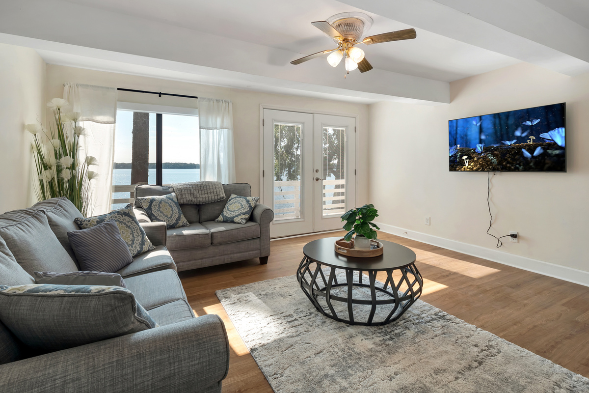 Lower portion living room.  4k tv, queen sleeper sofa, access to lower patio