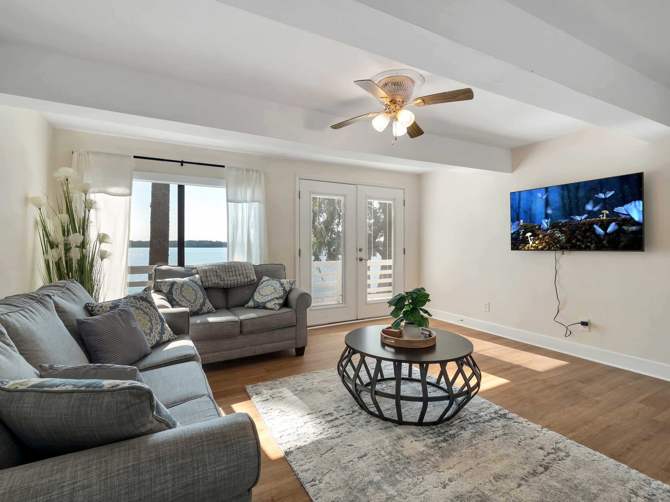 Lower portion living room.  4k tv, queen sleeper sofa, access to lower patio