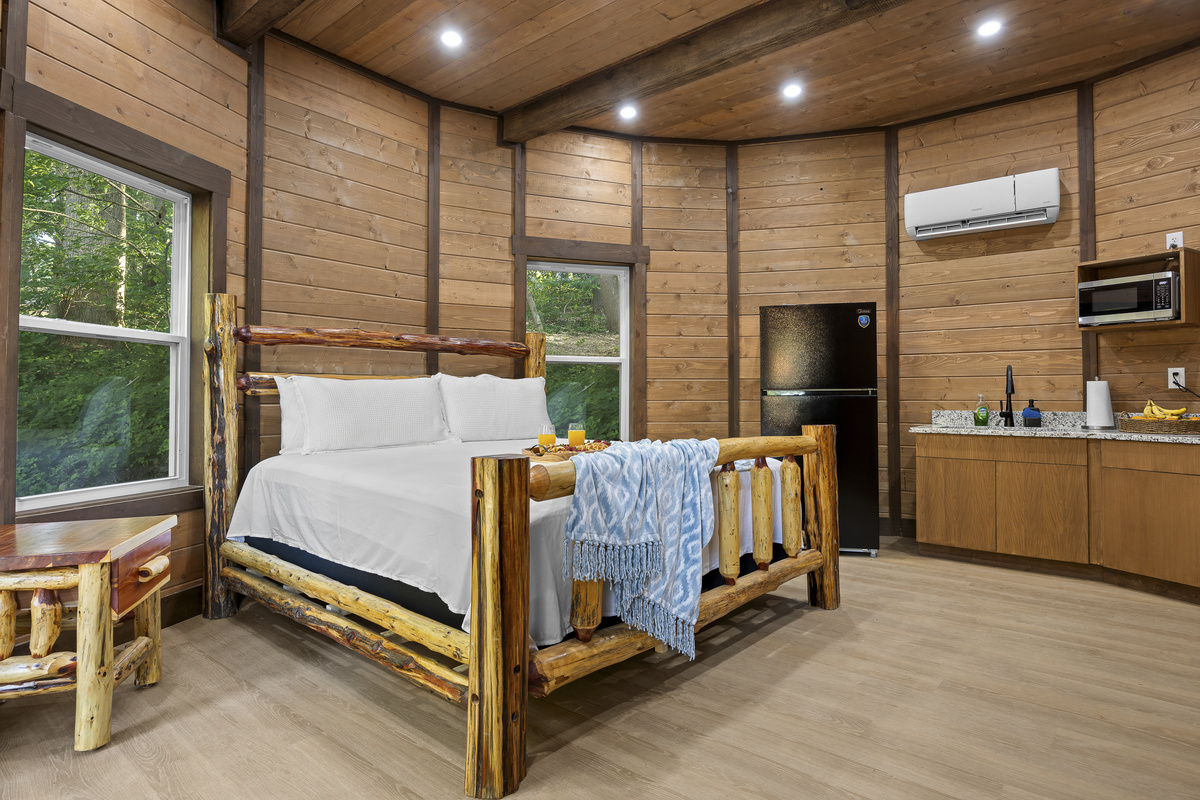Rustic Retreat: Experience nature in style with a charming log bed and serene woodland views!