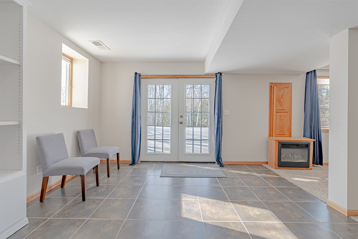 Downstairs patio doors that lead to the huge yard and path to Tioga Pit!