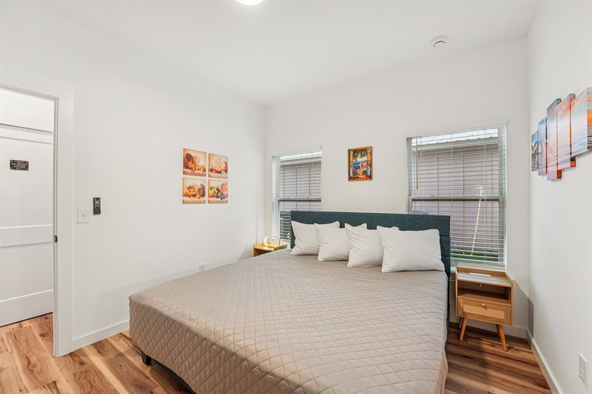 Primary Bedroom has a King size bed, ensuite bathroom with walk-in shower and double vanity, dresser with smart TV on top, lighted mirror, pack n play and air mattress always available inside the closet.