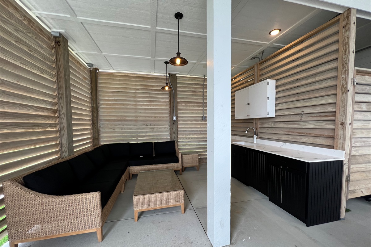 2025 Newly added comfy seating with tv, sink & mini fridge.