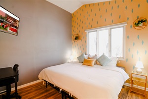 Plush Paradise: A restful haven adorned with sufficient pillows, ensuring a cozy and supportive environment for a perfect night's sleep or a leisurely day in.