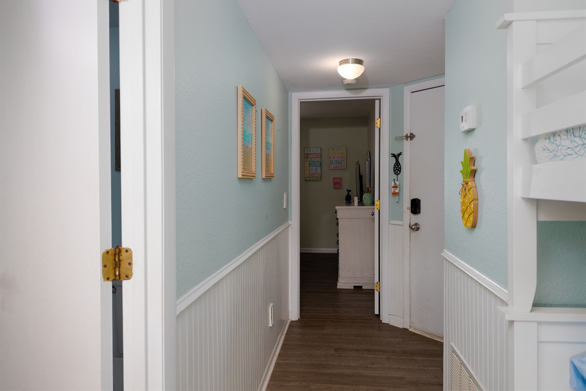 Hallway connecting the bunk area, bedroom, and main living space