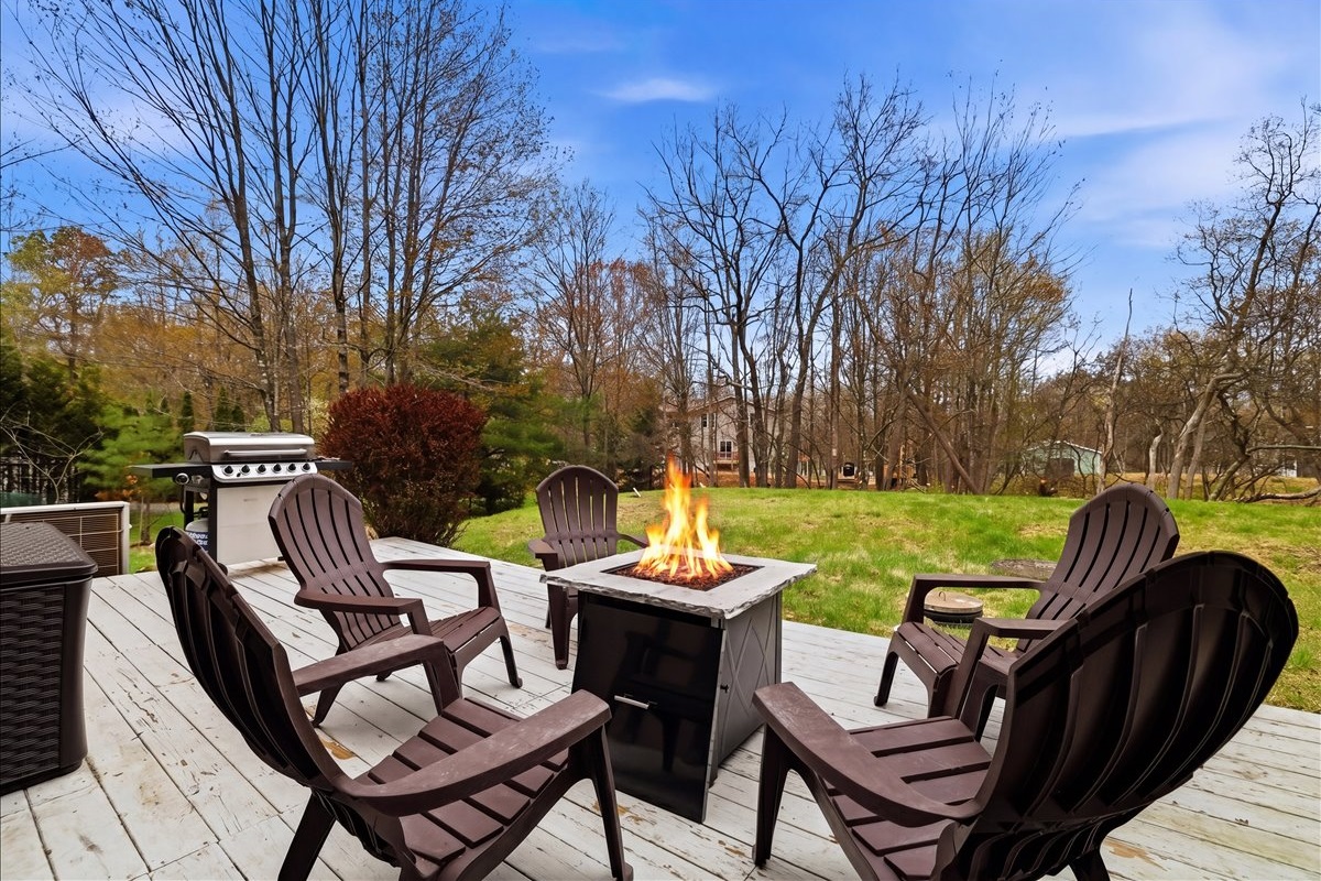 Evenings on the deck are made for the gas fire table, adirondack chairs, and good company under the open sky