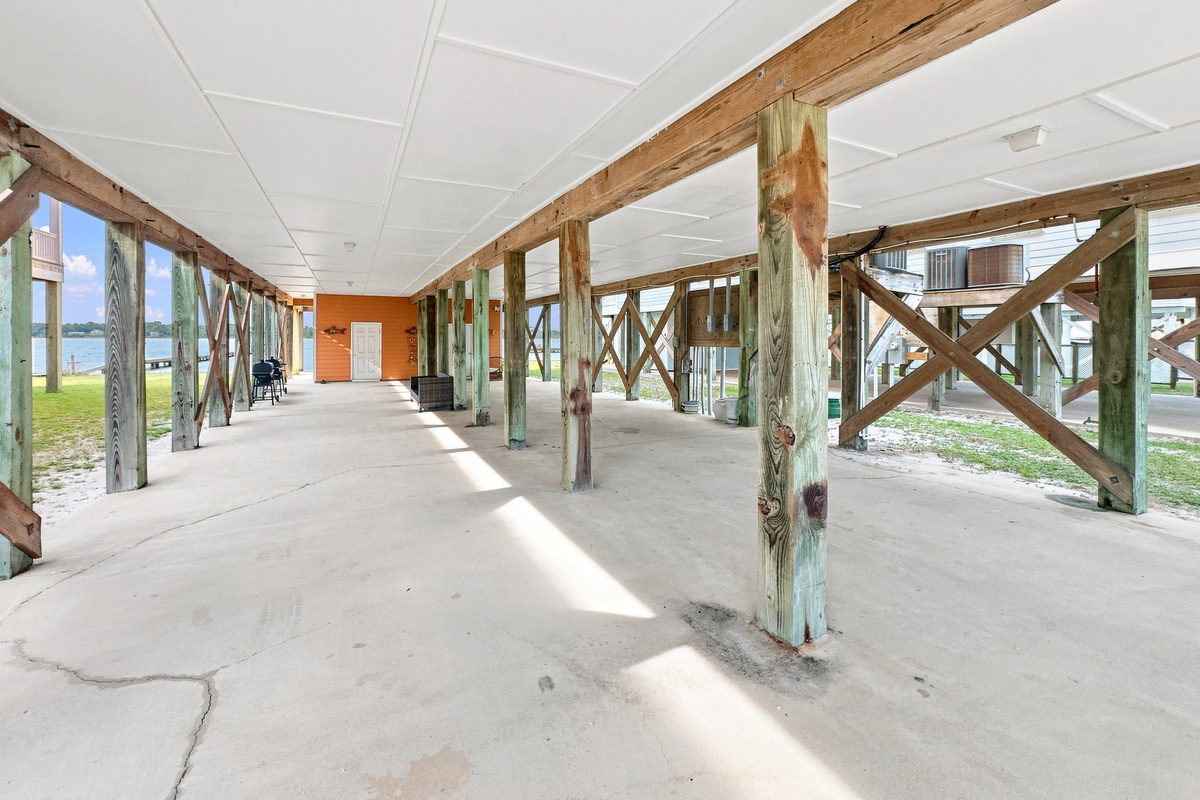Spacious covered ground level with room for parking and gear