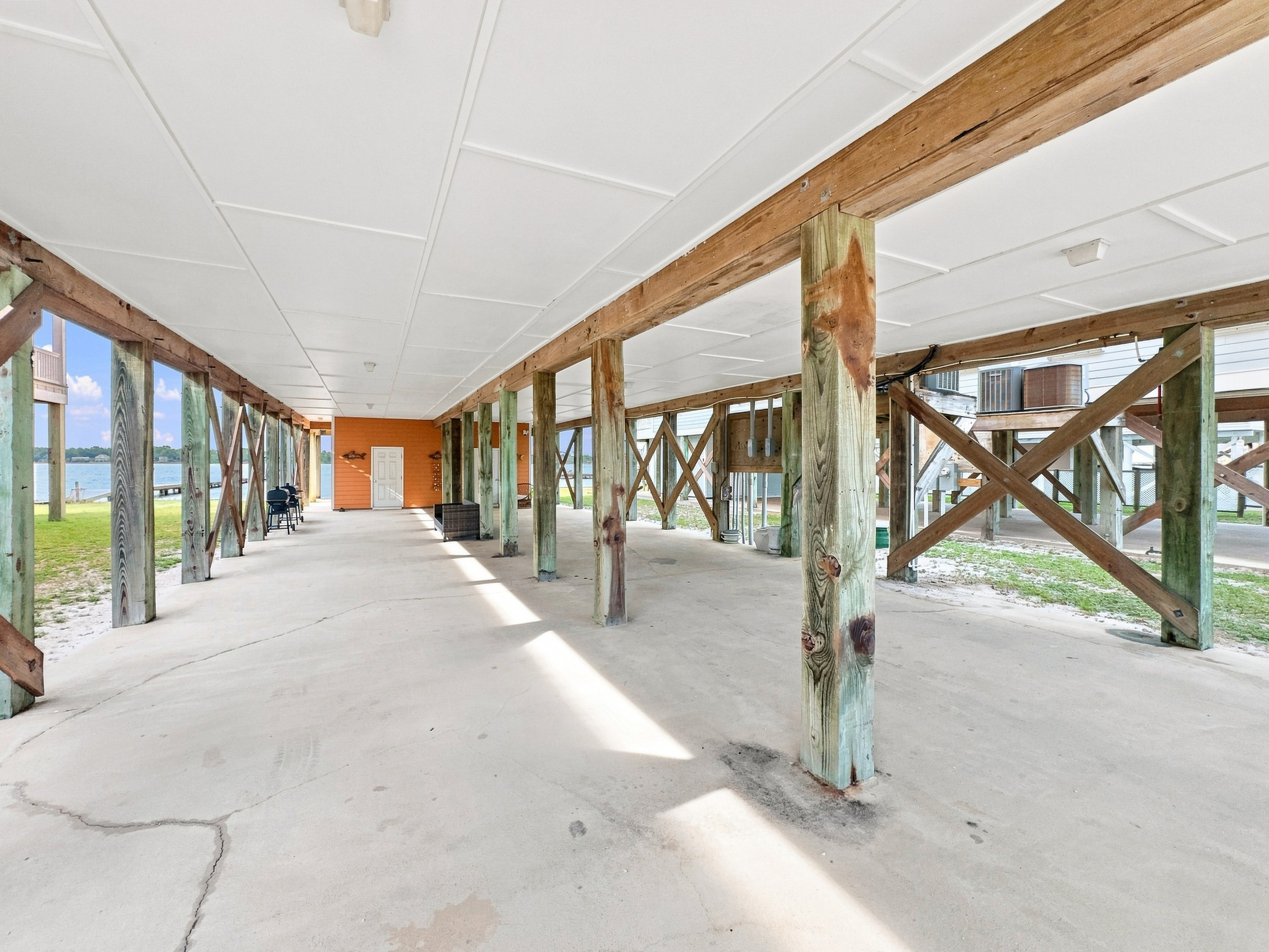 Spacious covered ground level with room for parking and gear