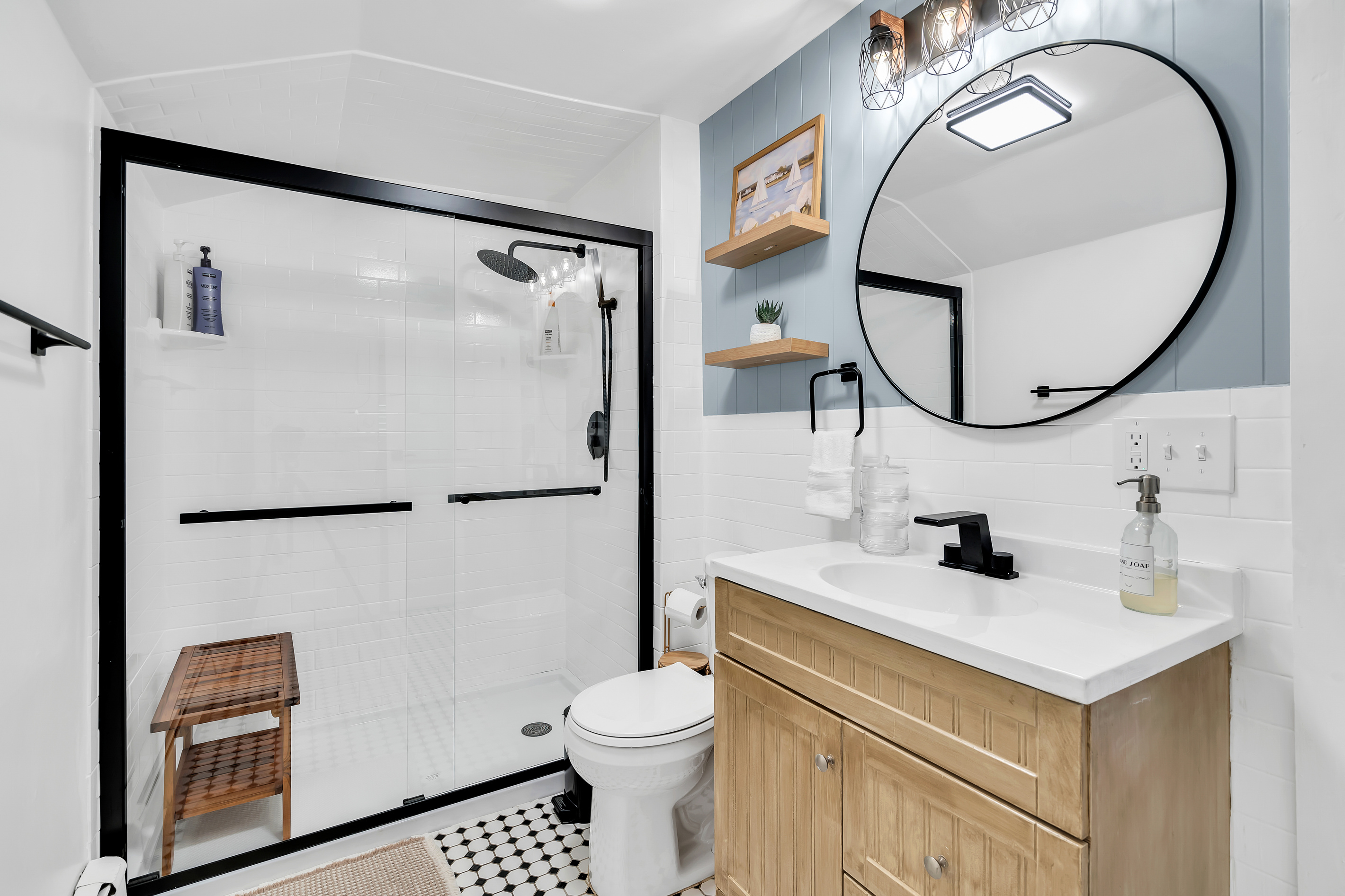 Step into the walk-in glass shower and rinse off the sand. The modern bathroom comes fully stocked, so you can feel at home from the first night.