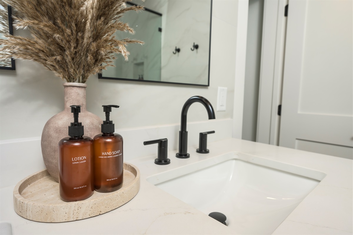 Ensuite Bathroom 3 - Attached to King Suite 3. Featuring enormous rain shower with quad showerheads, and spa-quality marble finishes. Includes premium toiletries (body wash, shampoo, conditioner, hand soap) and hotel quality towels. 