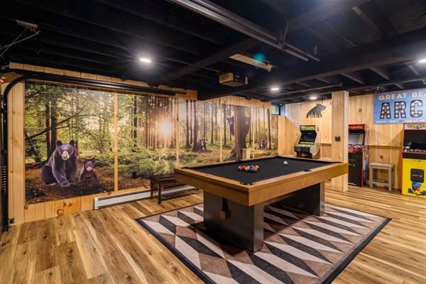 Custom black bear artwork behind pool table