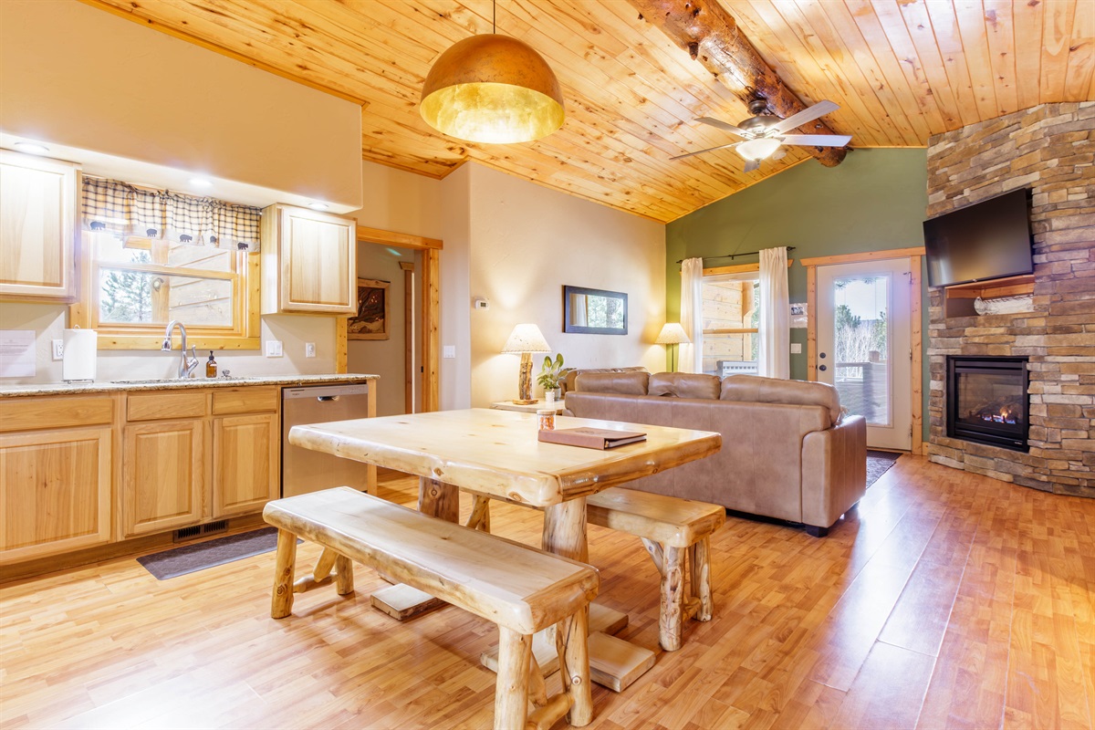 Spacious dining area and family room with fireplace.