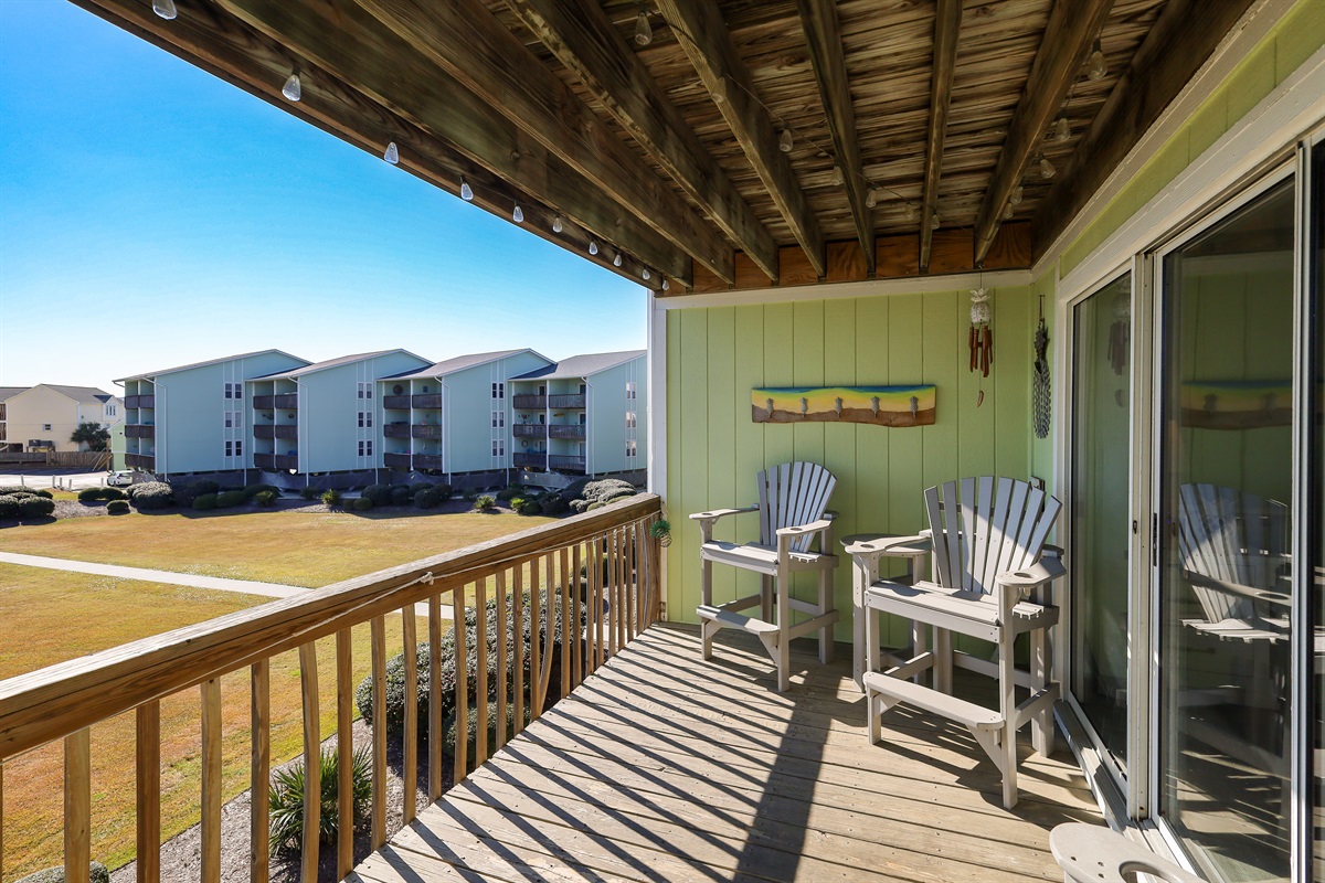 Private balcony with seating and views of the community grounds