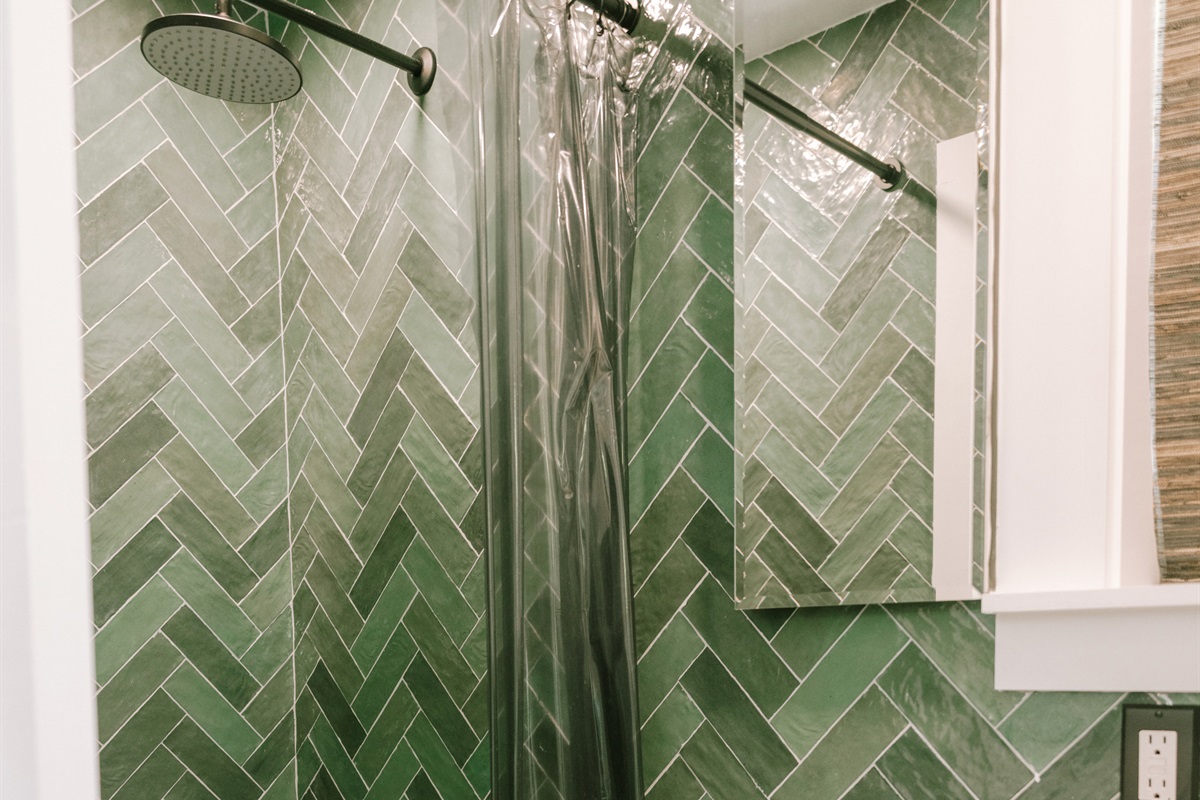 On the main floor, there is a freshly renovated bathroom featuring a shower stall.