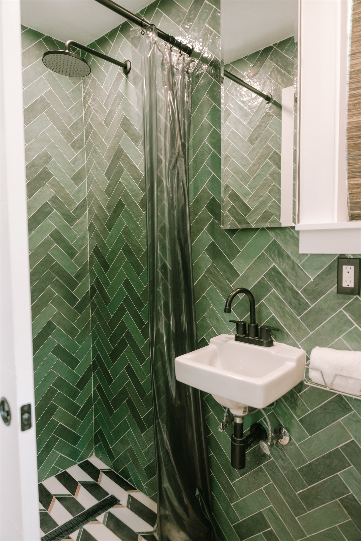 On the main floor, there is a freshly renovated bathroom featuring a shower stall.