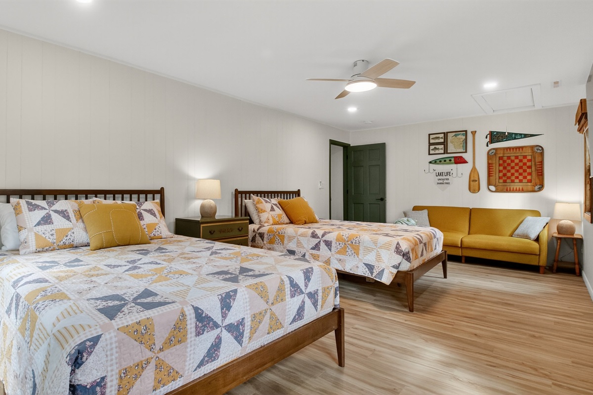 This spacious room has two queen beds, a comfortable couch, and Roku TV. A perfect room for the kids or adults who want extra space to spread out. 