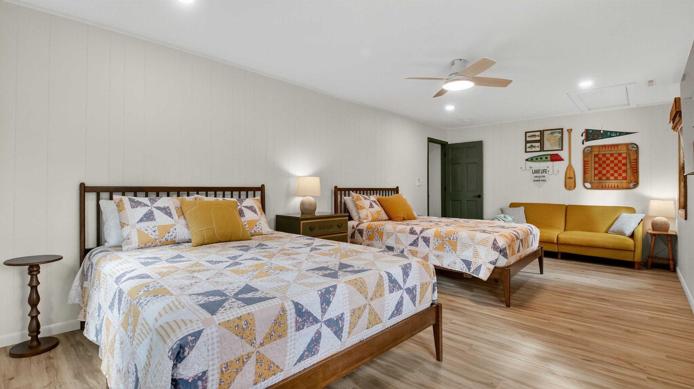 This spacious room has two queen beds, a comfortable couch, and Roku TV. A perfect room for the kids or adults who want extra space to spread out. 