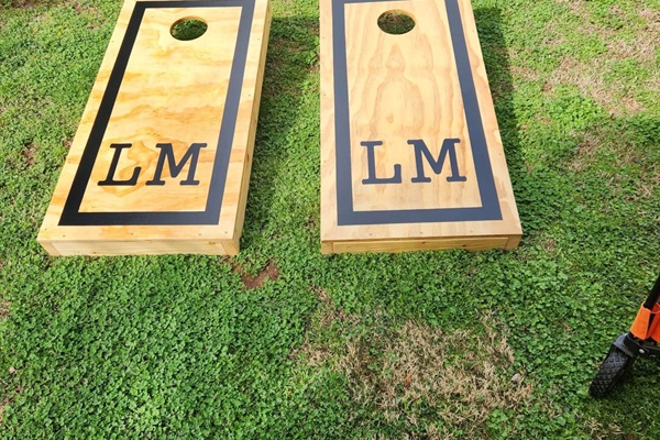 Relax, unwind, and challenge your friends & family to a game of cornhole in the back yard.