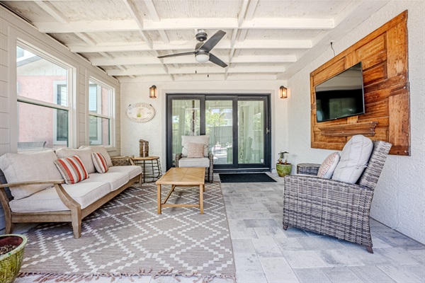 Covered outdoor patio area with seating
