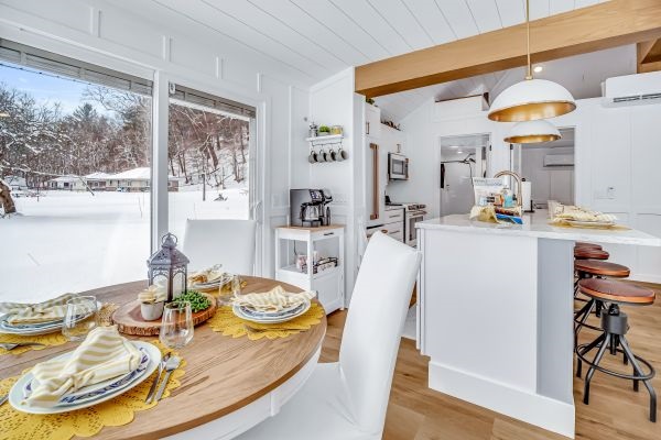 Sunrise cottage - Full kitchen has everything you need to prepare meals. Just steps to the kitchen table, large island counter or out the side slider to the waiting picnic table and large poly wood chairs.