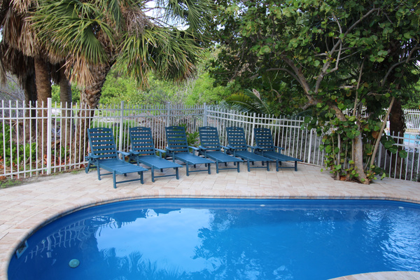 Outdoor Paradise: Dive into relaxation by the sparkling pool with ample lounging space!