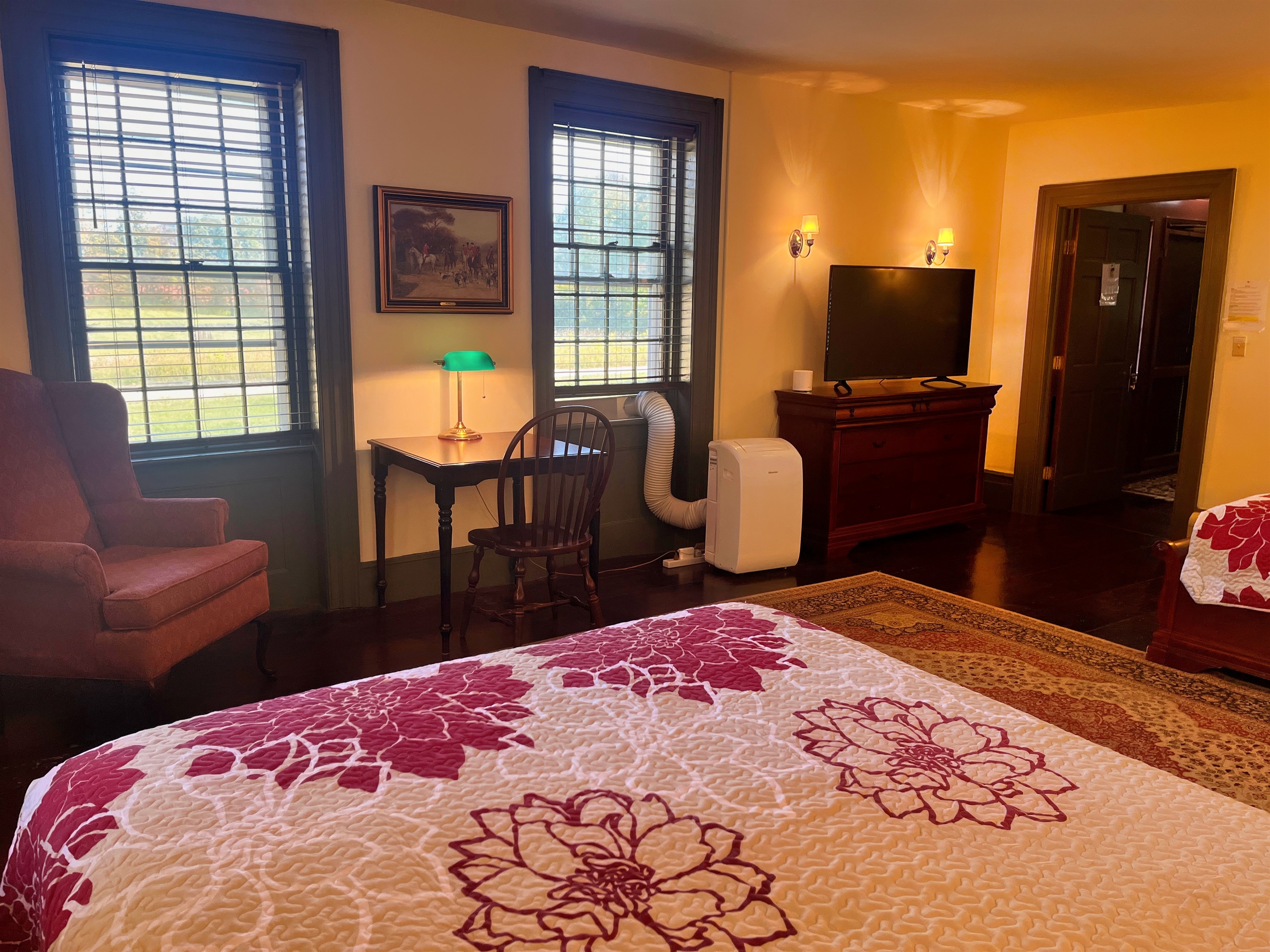 Guest room #4 with large Roku TV and sitting area.