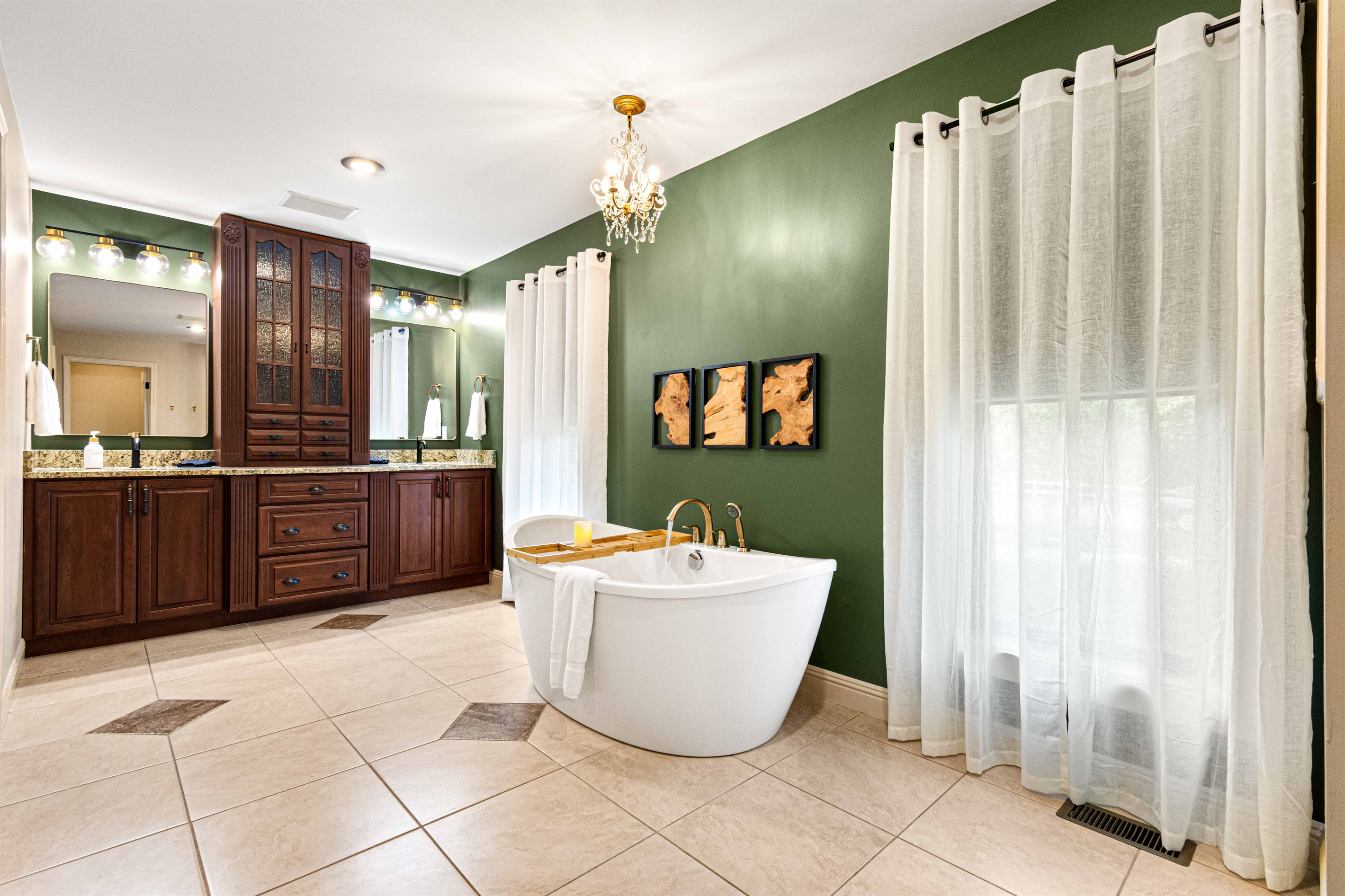 Primary bathroom on main level with soaker tub, walk in shower, double vanity sinks