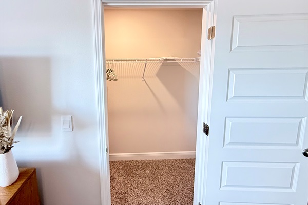 Primary bedroom walk-in closet