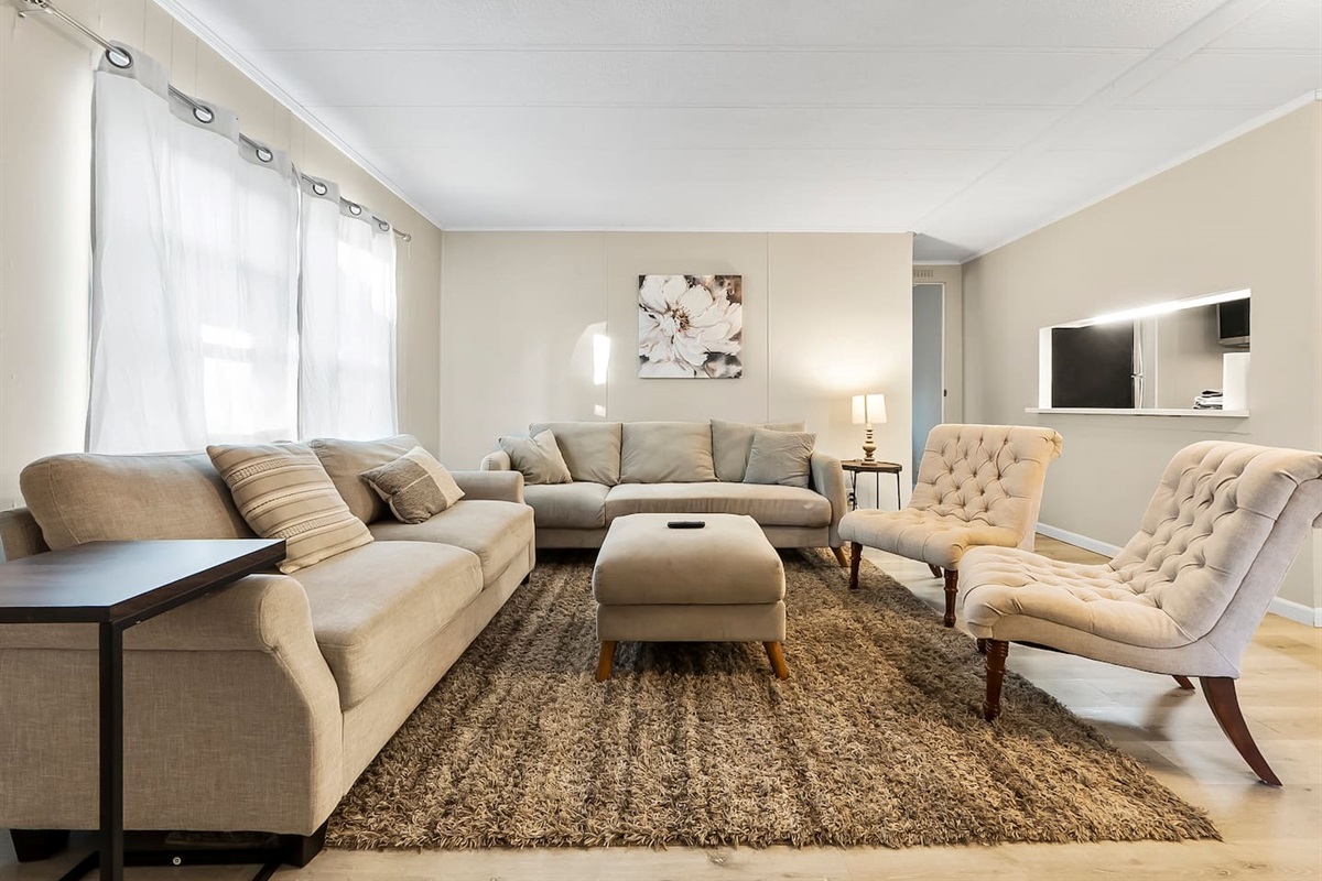 Bright and cozy living room with plush seating and soft natural light, perfect for relaxing after a day out in Indiana.