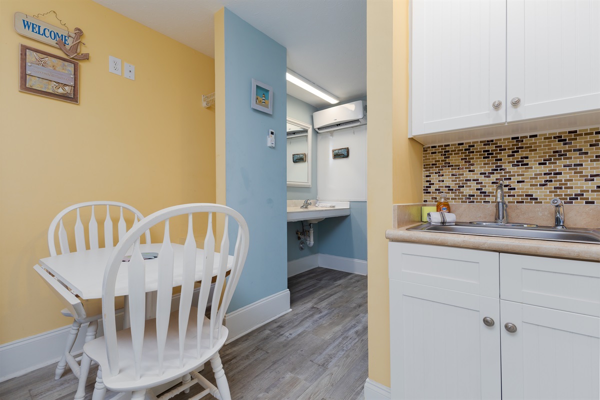 Cozy dining nook beside the kitchenette&mdash;perfect for enjoying breakfast, takeout, or a quick snack