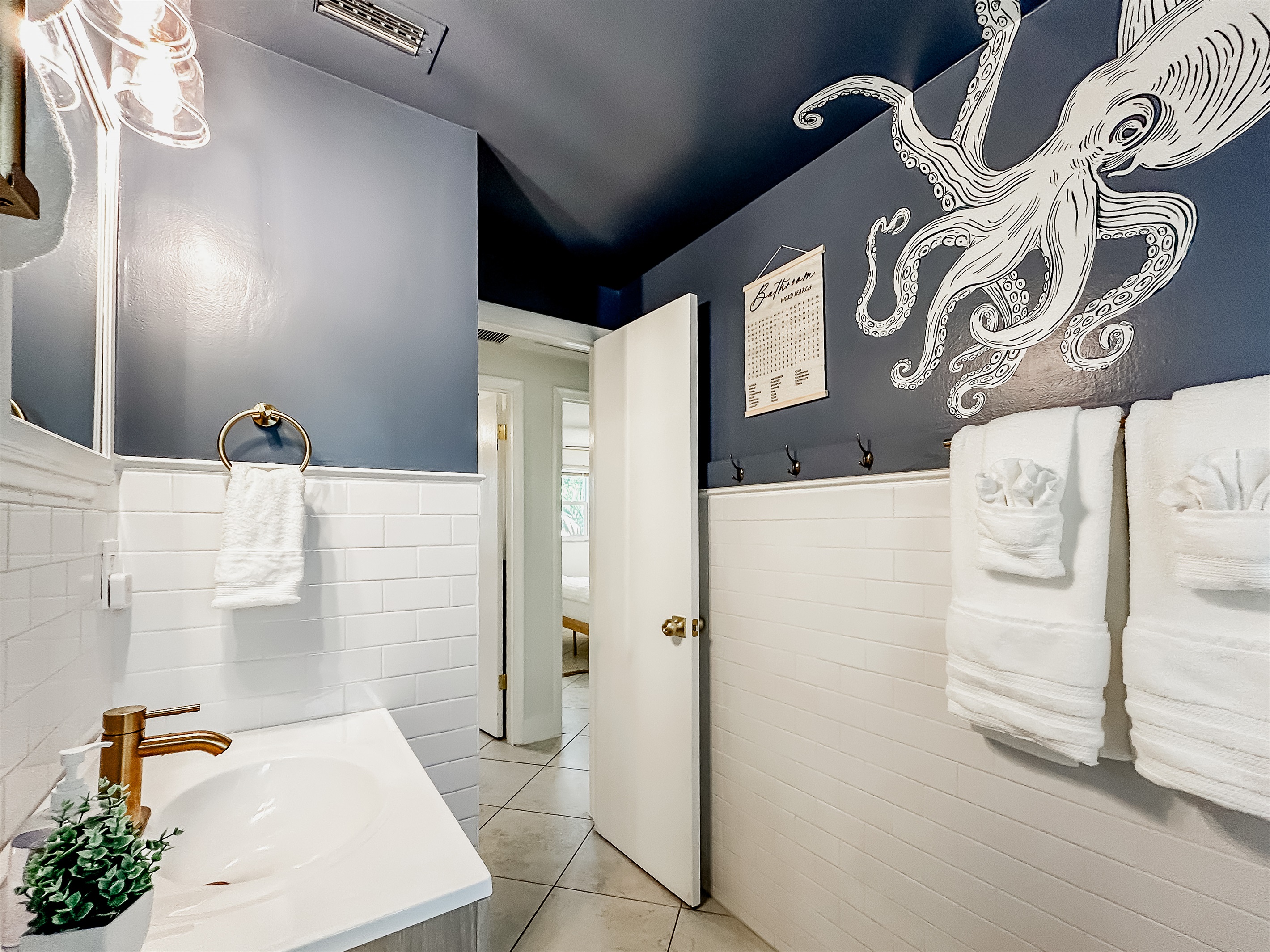 Full Bathroom with Custom Octopus Mural