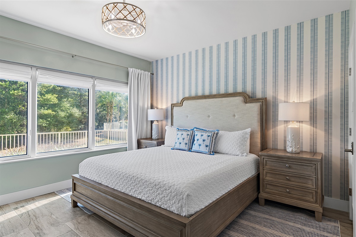 Spacious Master Bedroom with King Bed, Patio Access, Smart TV, and Private Remodeled Bathroom with Walk in Shower