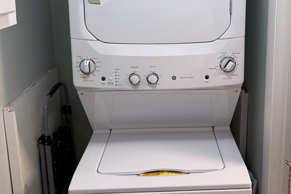 Stackable washer and dryer. We supply detergent pods for guest use.