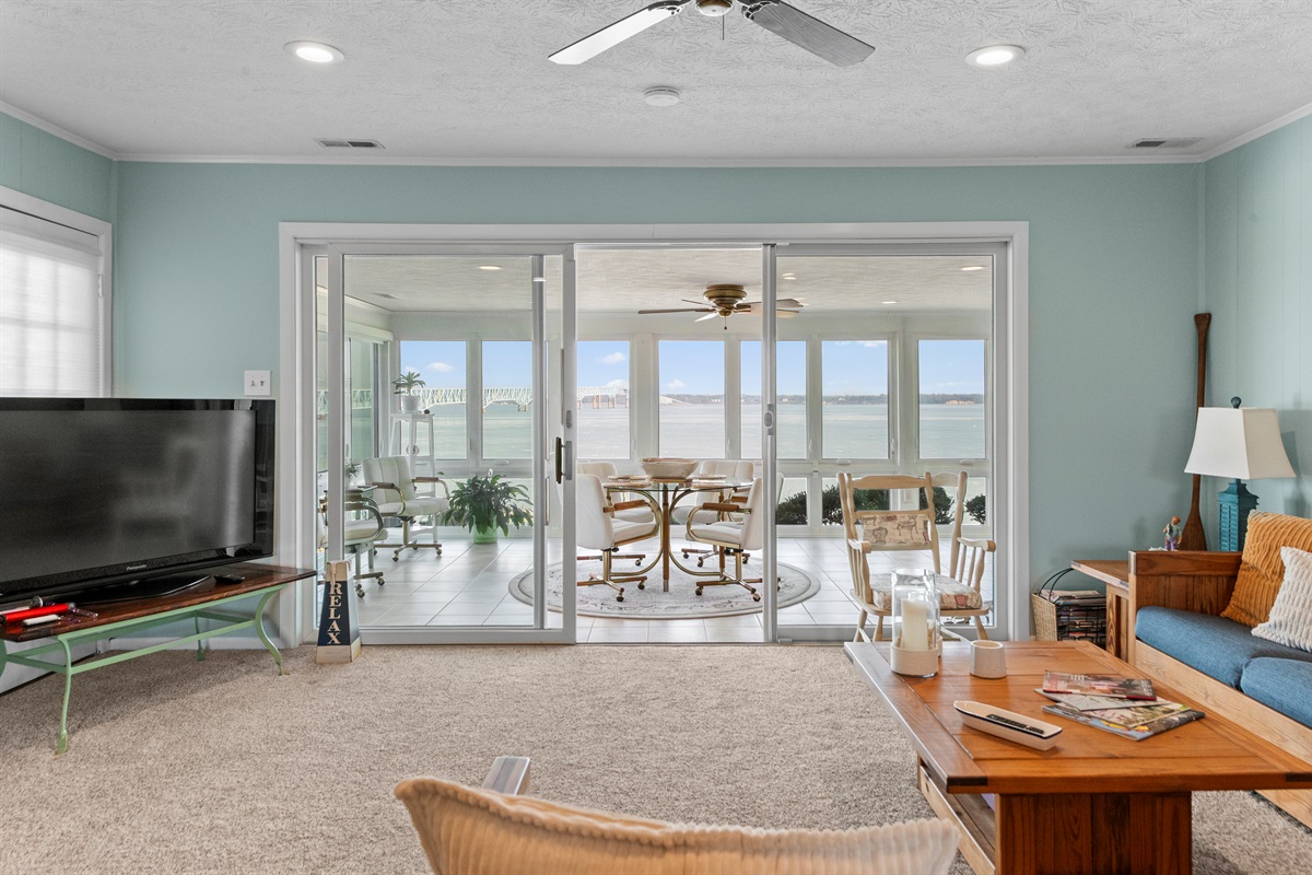 Sunroom Escape: Breathtaking views, bright decor, and perfect for morning coffee or evening chats!