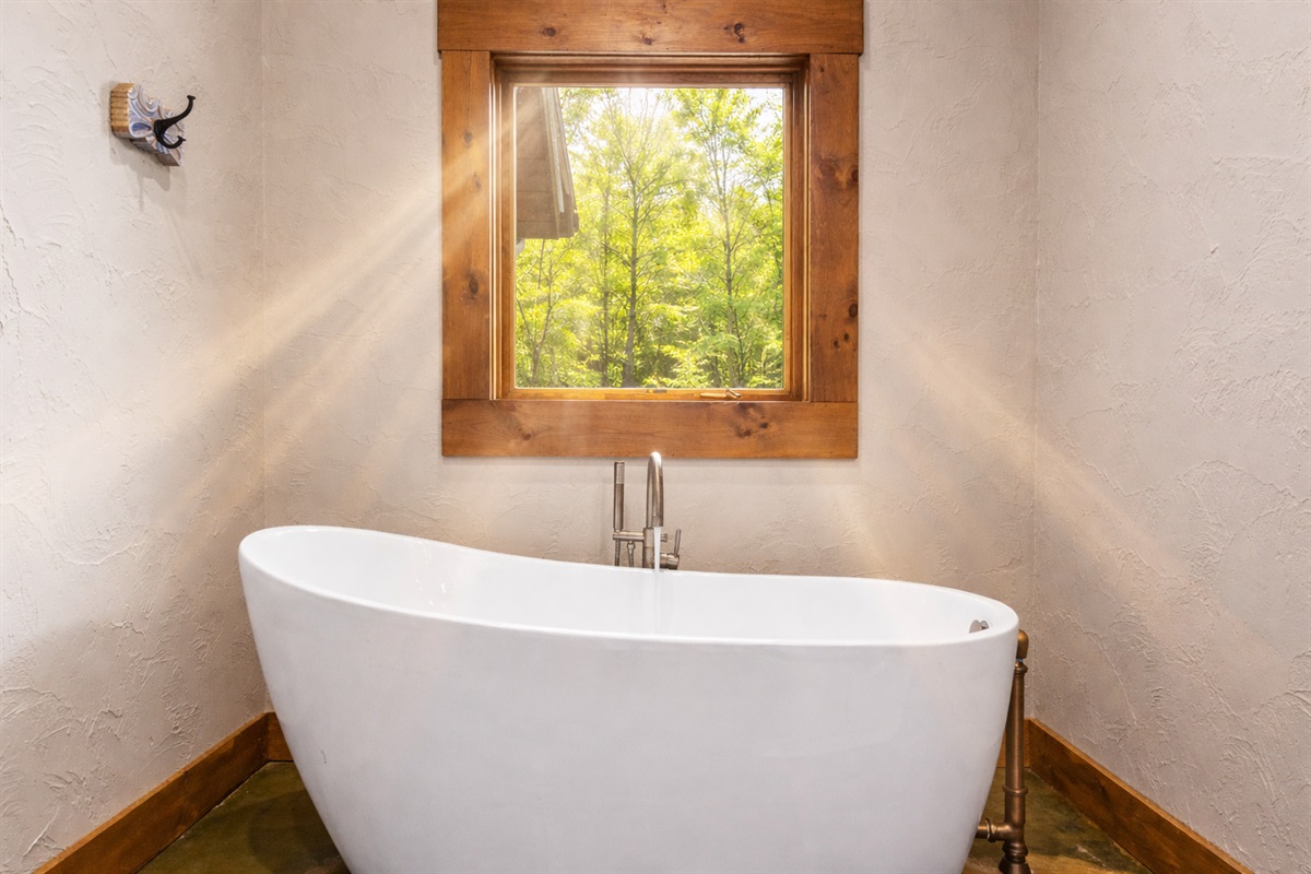 Soak, unwind, and let the sunshine pour in - Your private spa moment with peaceful summer views just outside.
