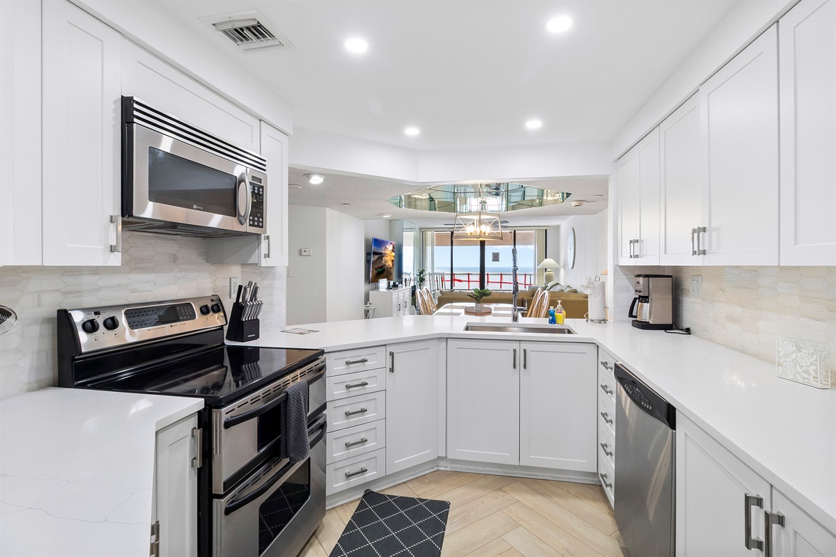 Beautiful updated kitchen, fully stocked with cooking/eating/drinking utensils
