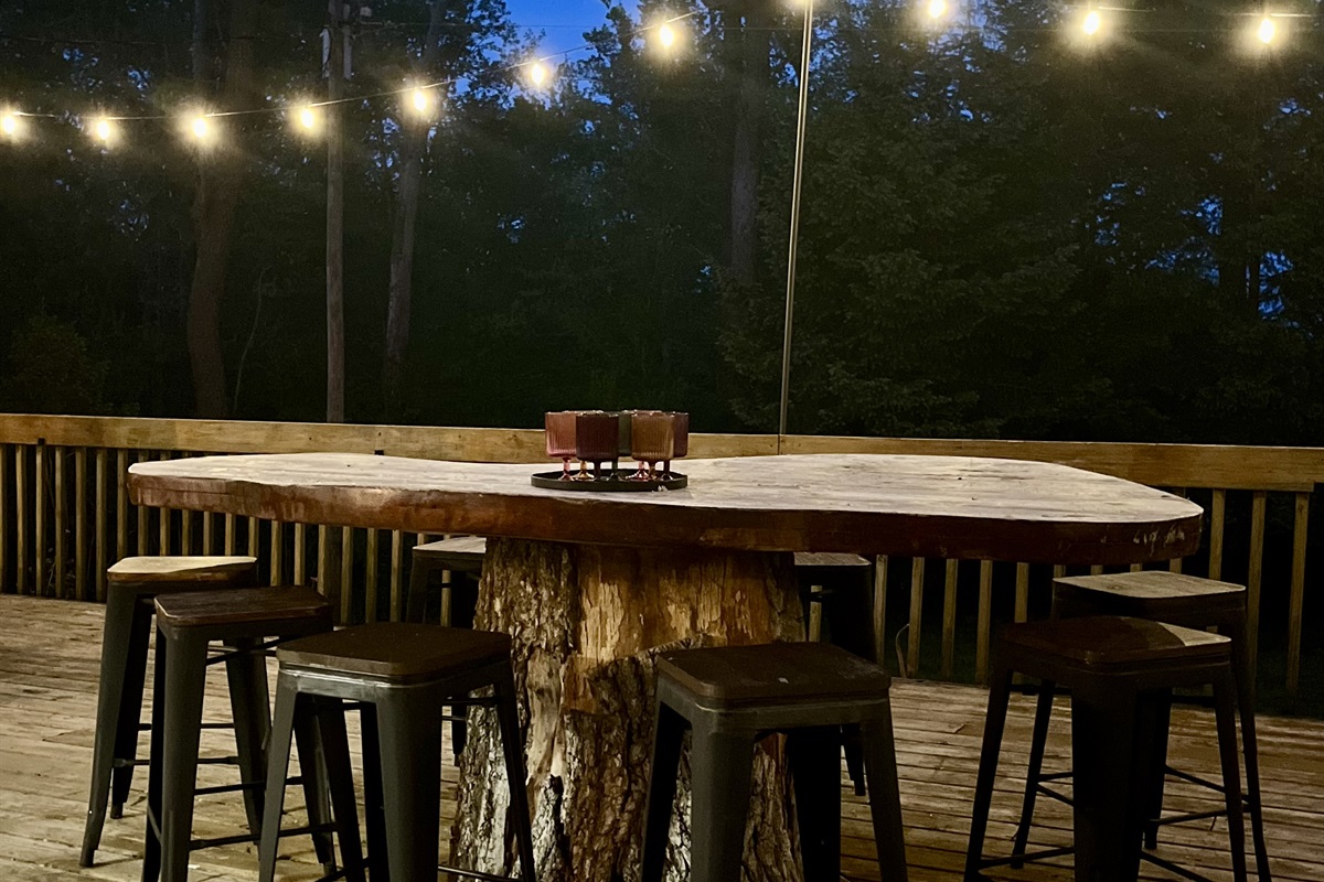 Elevate your experience by spending time in this magical space during your stay! The custom table on the deck is simply dreamy at night. 