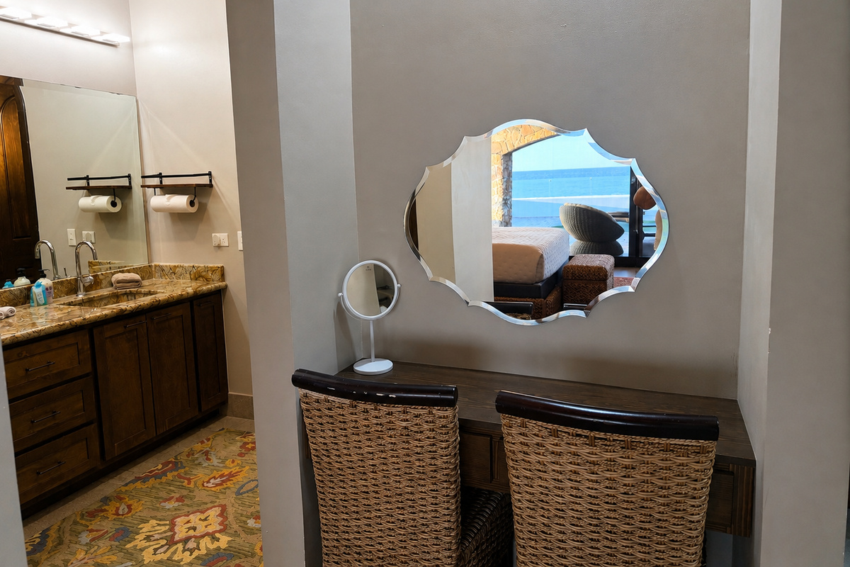 Primary En-Suite Bathroom: Enjoy a spacious en-suite bathroom featuring dual sinks, a walk-in stone shower, and a dedicated vanity area, providing plenty of space to get ready in comfort.