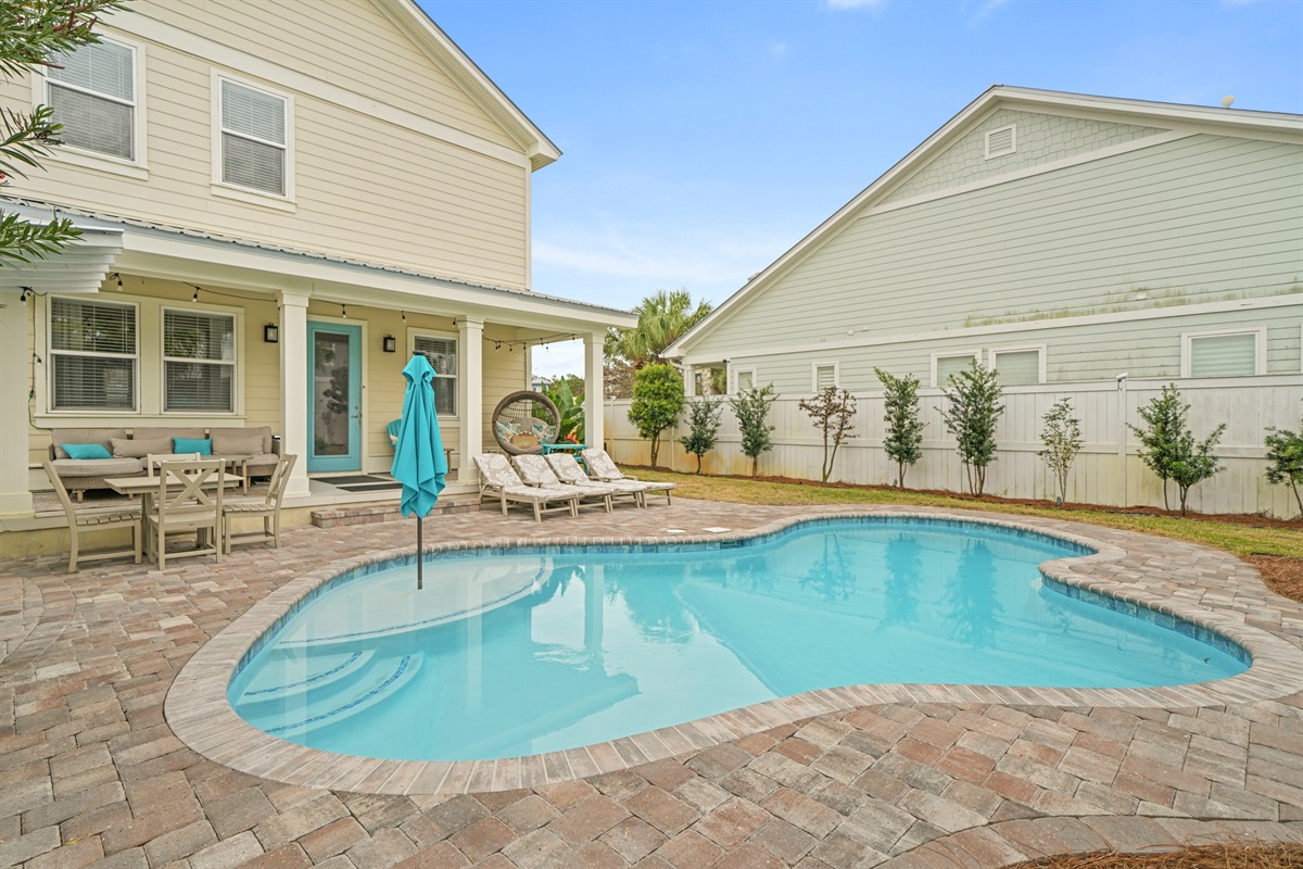 Inviting pool area with ample deck space for sunbathing and outdoor relaxation.
