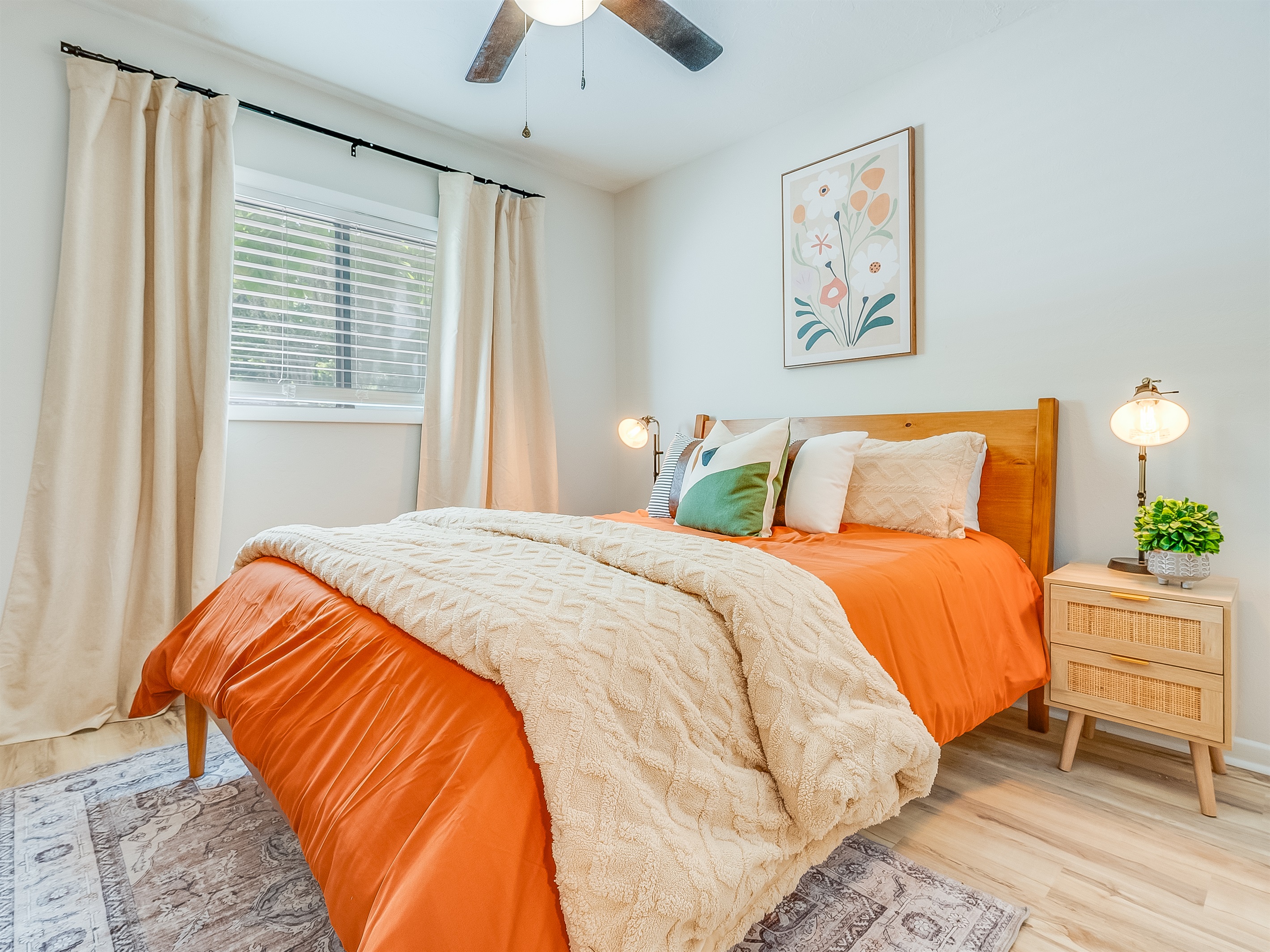 A bright and welcoming bedroom with a comfortable queen bed—perfect for unwinding after a day out.