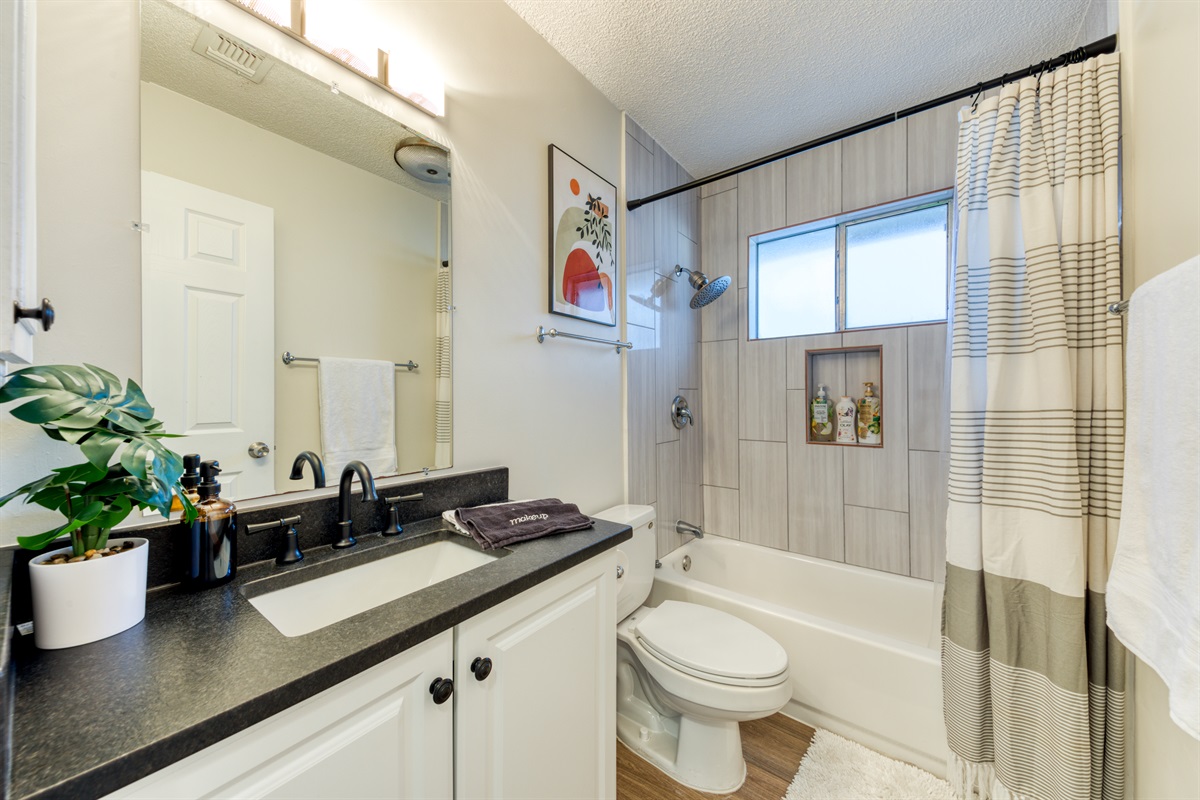 Common bathroom with shower and tub